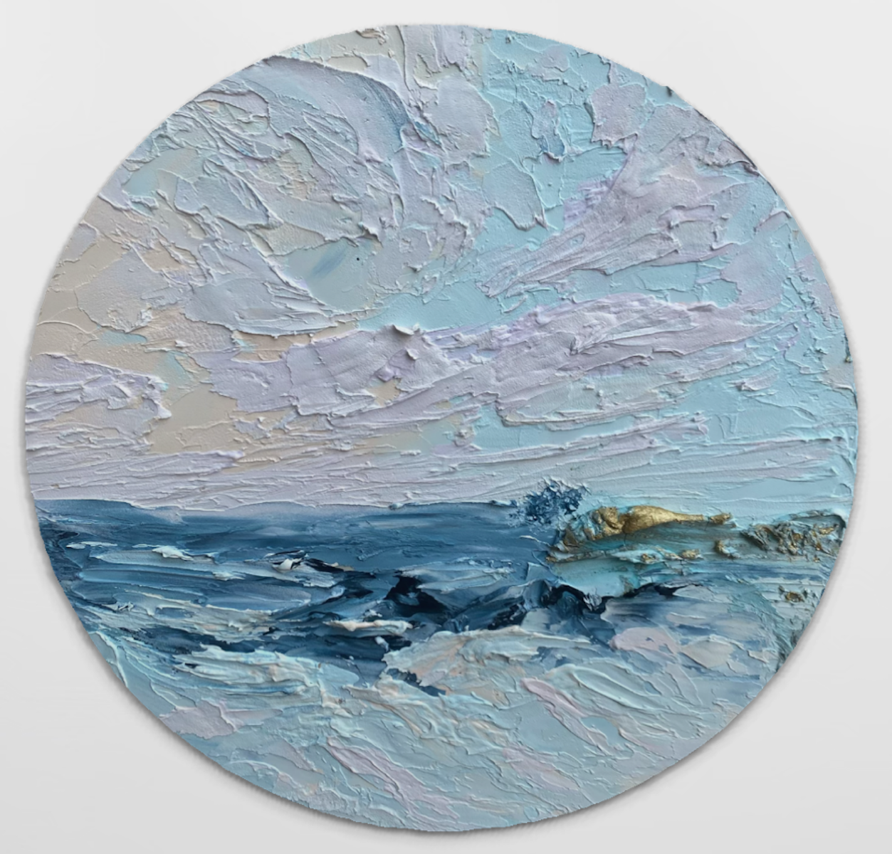 Round painting of a landscape with blue and gray tones